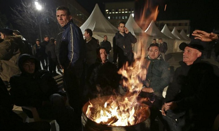 Kosovo elects new president, opposition protests